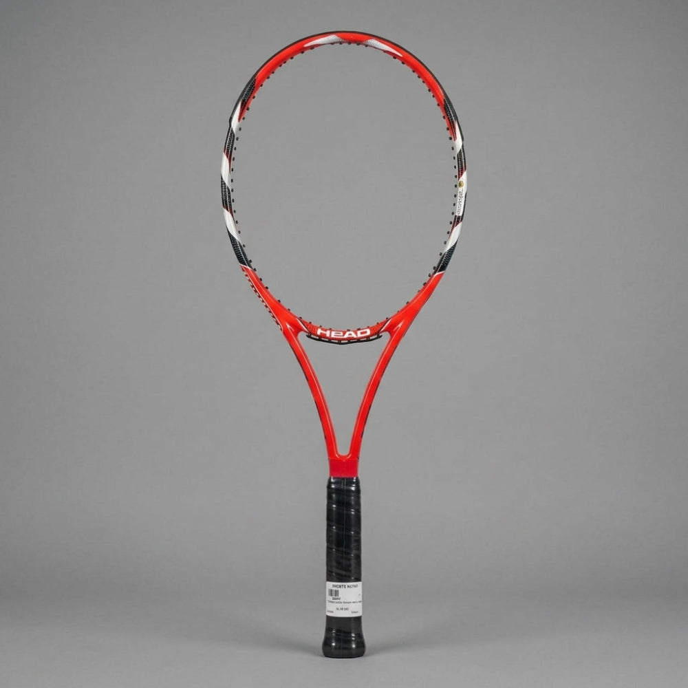 A red and black HEAD tennis racket with a black wrapped grip, standing upright against a solid gray background.